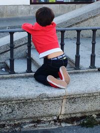 Rear view of girl standing in park