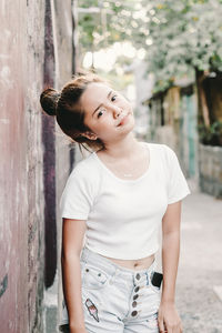 Portrait of young woman standing outdoors