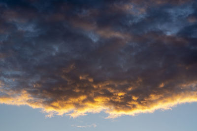 Low angle view of cloudy sky during sunset