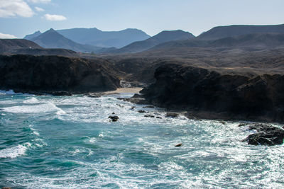 Scenic view of sea and mountains