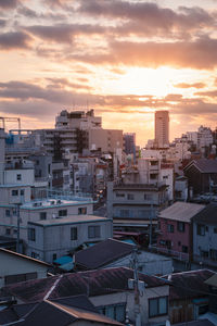 High angle view of buildings against sky during sunset