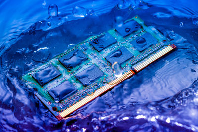 High angle view of computer chip in water