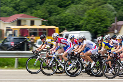 People riding bicycle on street