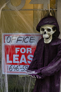 Halloween skeleton real estate agent