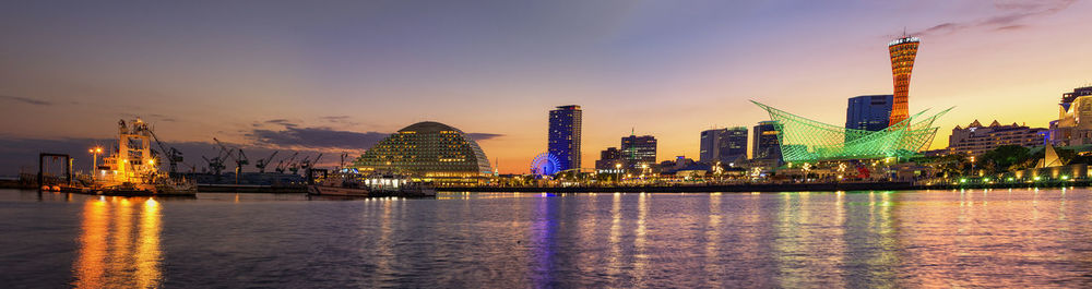 Illuminated city at waterfront