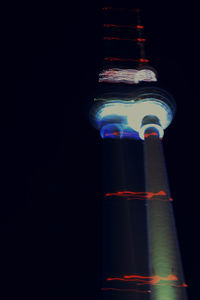 Low angle view of illuminated lights at night