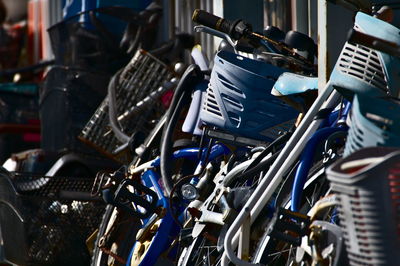 Close-up of bicycle parked in row