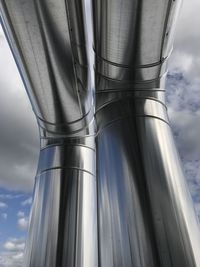 Low angle view of smoke stack against sky