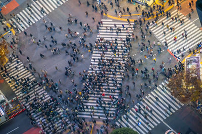 High angle view of people crossing street