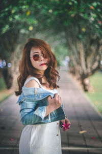 Portrait of young woman standing outdoors