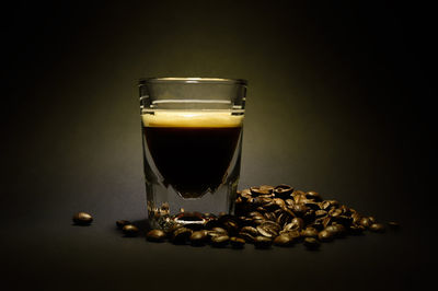 Close-up of coffee beans against gray background