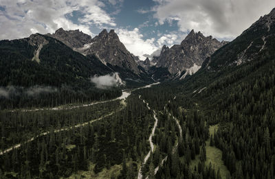 Panoramic shot of land and mountains against sky