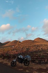 Bicycles on land against sky