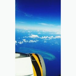 Aerial view of landscape against blue sky