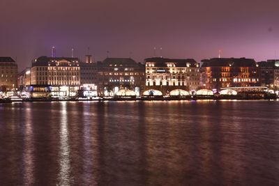 Illuminated city at waterfront