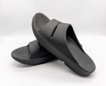 Close-up of shoes against white background