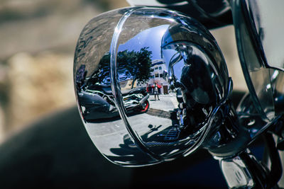 Close-up of motorcycle in city
