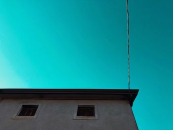 Low angle view of building against blue sky