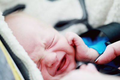 Close-up of crying newborn baby girl