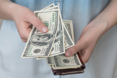 Close-up of a hand holding paper