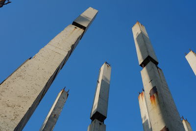 Low angle view of tower against clear blue sky