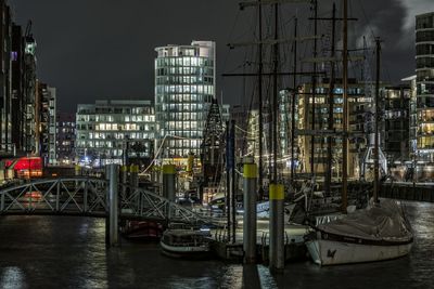 Boats moored at harbor