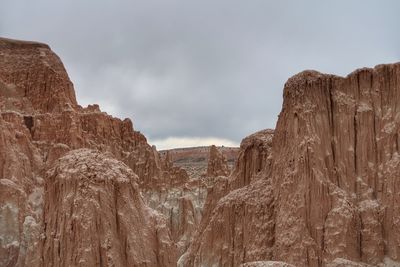 Low angle view of rock formation against sky