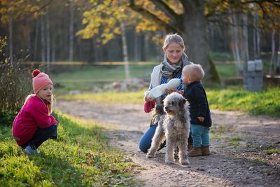 Family with dog at park