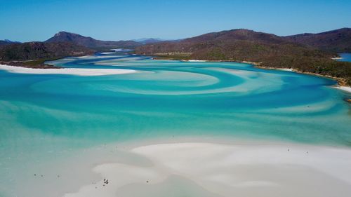 Scenic view of mountains against clear blue sky