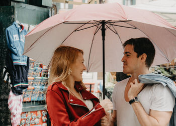 Young couple kissing in rain