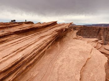 Rock formations in desert against sky