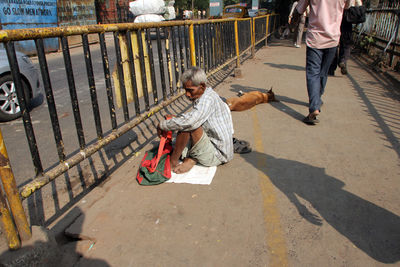 High angle view of people walking on footpath