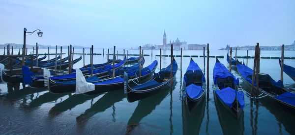 Boats moored in canal