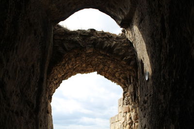 Low angle view of arched wall