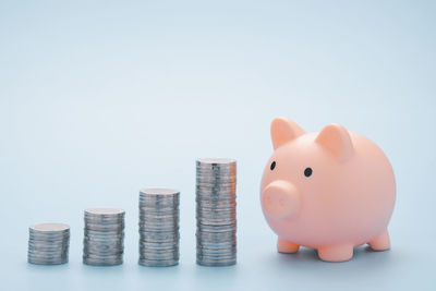 Stack of coins over white background