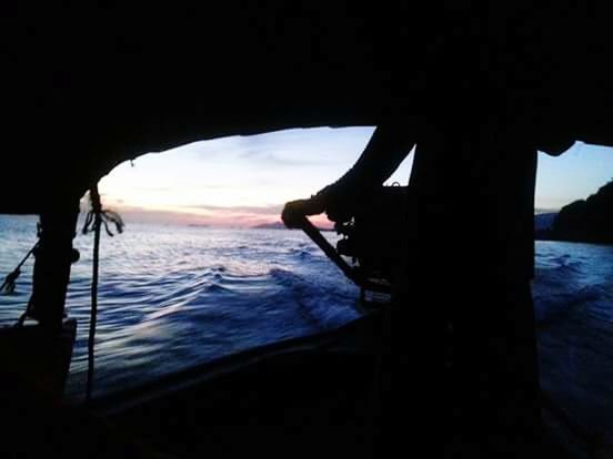 water, sea, silhouette, lifestyles, leisure activity, beach, person, standing, horizon over water, sky, full length, rear view, shore, men, vacations, nature, sunlight, sunset