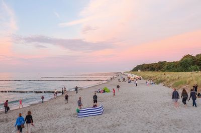 Scenic view of beach against sky during sunset