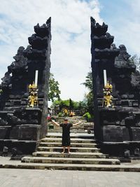 Rear view of woman walking in temple