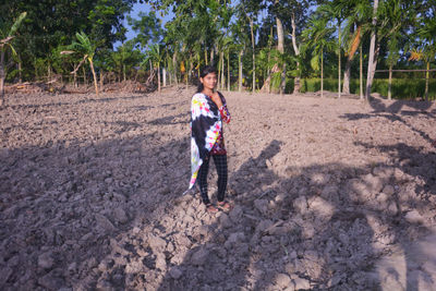 Full length of woman standing on land