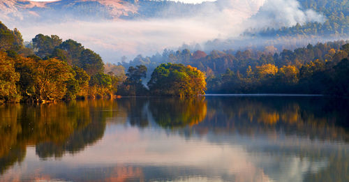 Scenic view of lake against sky during autumn