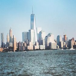 Skyscrapers in city against clear sky