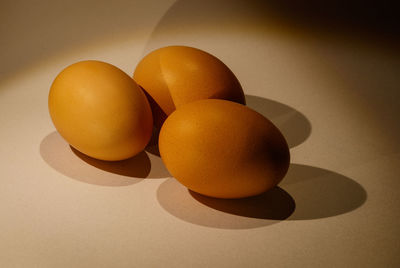Close-up of yellow eggs on table