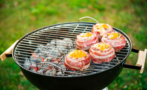 High angle view of meat on barbecue grill