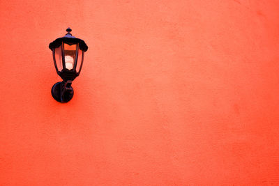 Full length of man hanging on wall