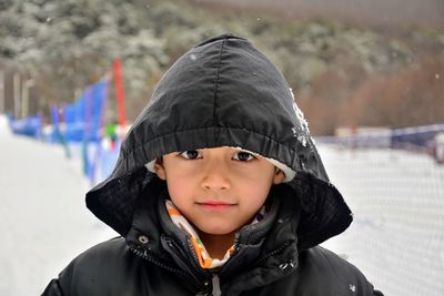 Portrait of smiling boy in snow