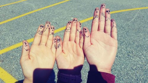 High angle view of people hands in swimming pool