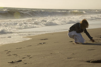 Rear view of women on beach