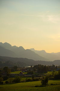 Scenic view of field against sky during sunset