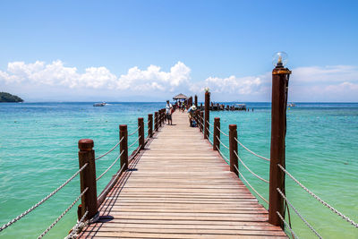 Pier over sea against sky