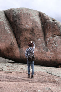 Full length of man standing on rock